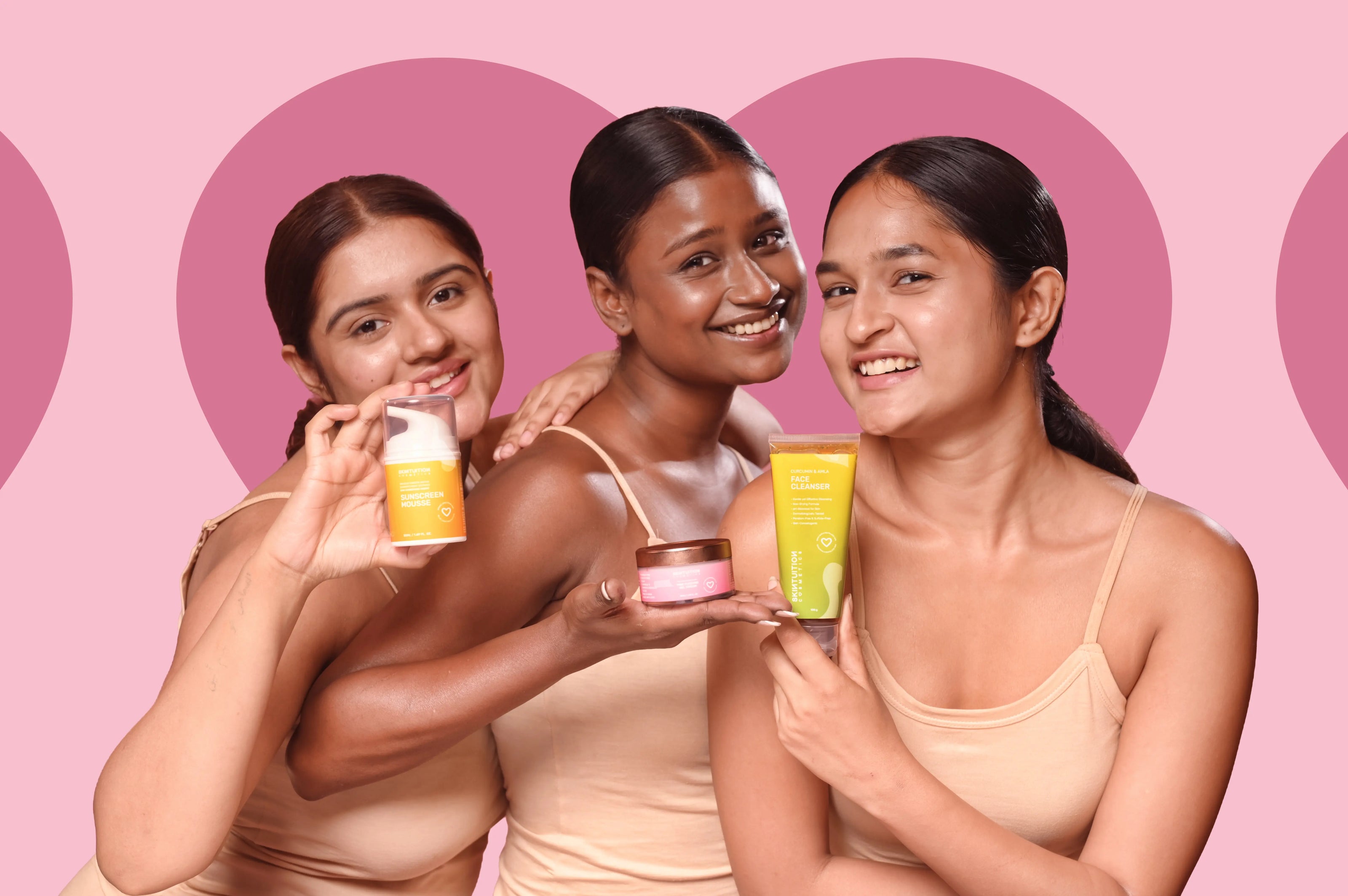 Young Indian women using Skintuition Cosmetics clean skincare products including cleanser, sunscreen and body butter