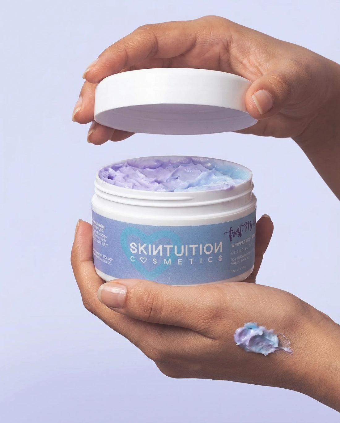 Cloud Butter whipped body cream jar and packaging by Skintuition Cosmetics on pastel background