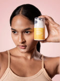 Woman holding Skintuition Cosmetics sunscreen mousse skincare product