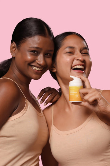 Woman applying SPF 50 PA++++ sunscreen mousse for oily and acne-prone skin in India